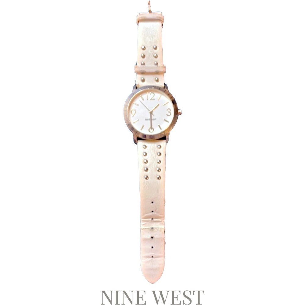 Nine West analogue watch with stainless steel backing and latch. Leather band.